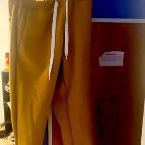A large khaki colored sweatpants, Slightly worn ..
